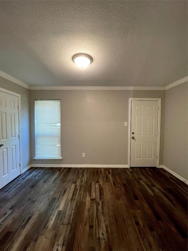 interior space with crown molding, baseboards, and dark wood-style flooring