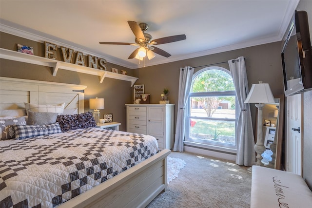 bedroom featuring carpet, crown molding, and ceiling fan