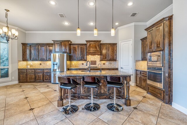 6055 The Resort Blvd, Fort Worth, TX 76179 - kitchen featuring appliances with stainless steel finishes, light tile patterned floors, a sink, light stone countertops, and crown molding