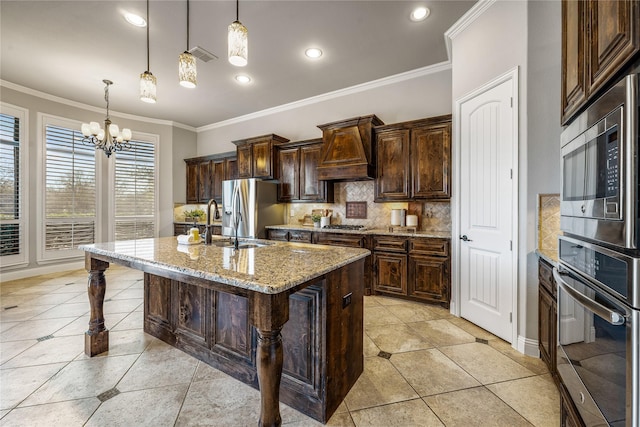 6055 The Resort Blvd, Fort Worth, TX 76179 - kitchen featuring stainless steel appliances, custom exhaust hood, decorative backsplash, crown molding, and light stone countertops