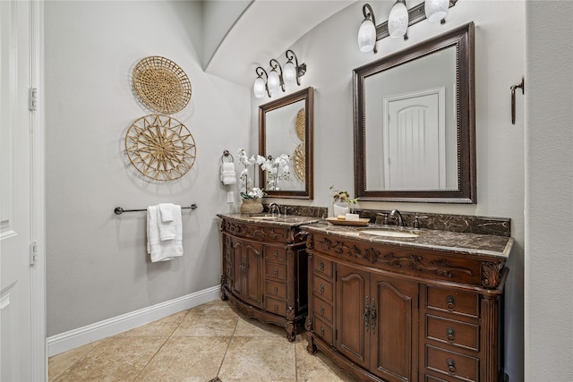 6055 The Resort Blvd, Fort Worth, TX 76179 - bathroom featuring double vanity, baseboards, and tile patterned floors