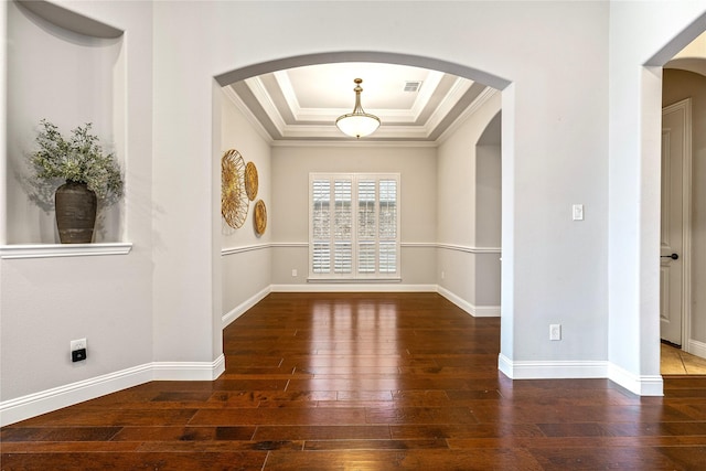 6055 The Resort Blvd, Fort Worth, TX 76179 - unfurnished room with a tray ceiling, arched walkways, crown molding, wood-type flooring, and baseboards