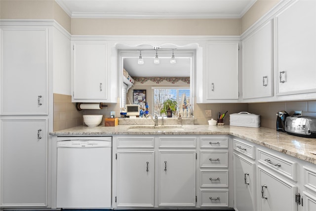 kitchen with white dishwasher, white cabinets, and a sink