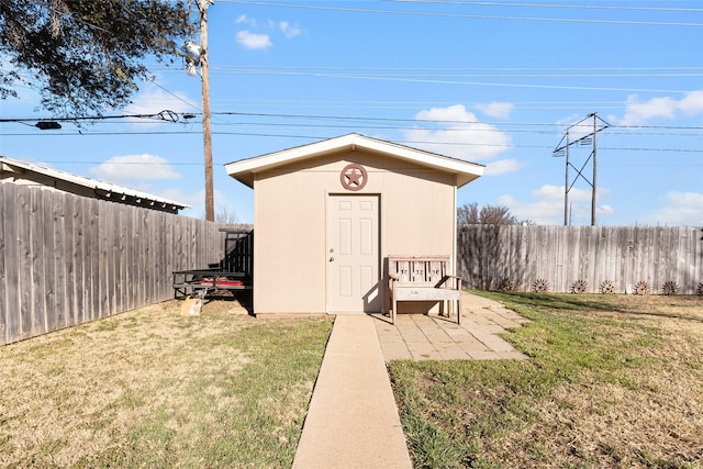 view of shed featuring a fenced backyard