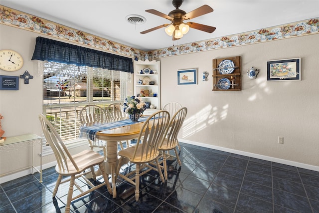 dining area with ceiling fan, visible vents, and baseboards