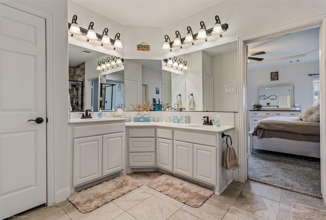 ensuite bathroom featuring double vanity, a ceiling fan, a sink, and ensuite bathroom