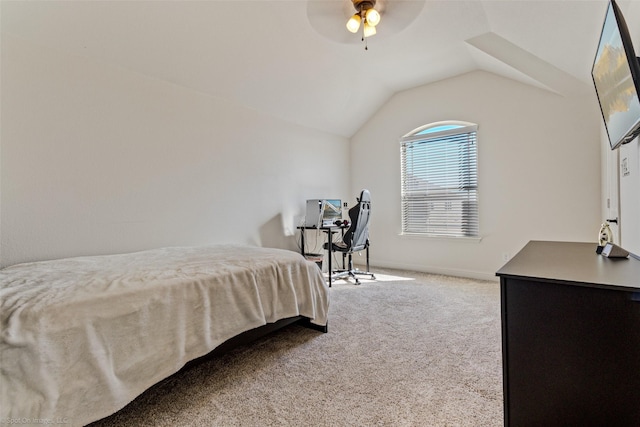 carpeted bedroom featuring lofted ceiling, a ceiling fan, and baseboards