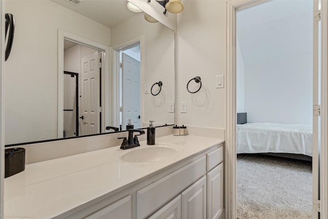 ensuite bathroom with ensuite bath, vanity, and visible vents