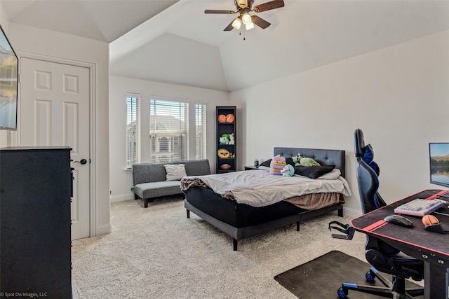 carpeted bedroom with lofted ceiling, baseboards, and a ceiling fan