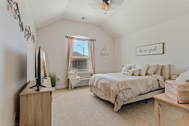 bedroom featuring light colored carpet, vaulted ceiling, a ceiling fan, and visible vents