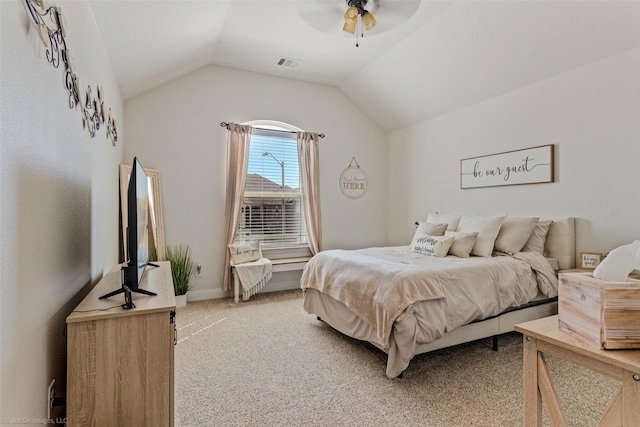 bedroom featuring lofted ceiling, light carpet, visible vents, baseboards, and a ceiling fan