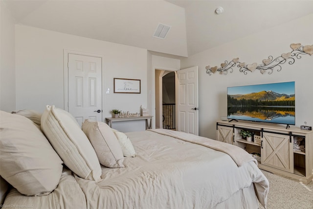 bedroom with arched walkways, visible vents, and vaulted ceiling