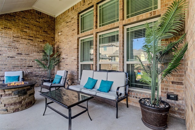 view of patio / terrace with an outdoor fire pit