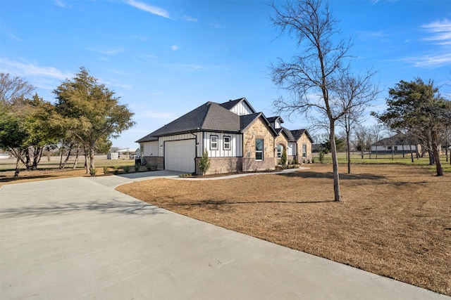 view of front of house featuring roof with shingles, brick siding, concrete driveway, board and batten siding, and a garage