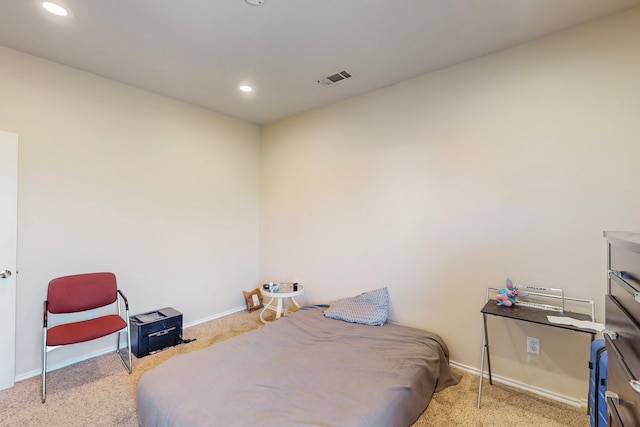 carpeted bedroom with recessed lighting, visible vents, and baseboards