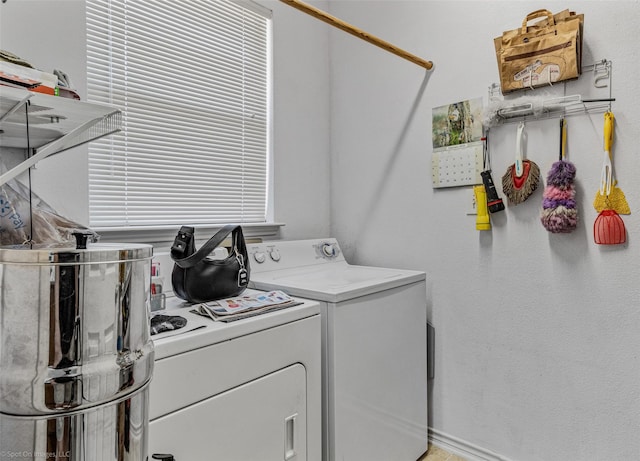 laundry area with laundry area and independent washer and dryer