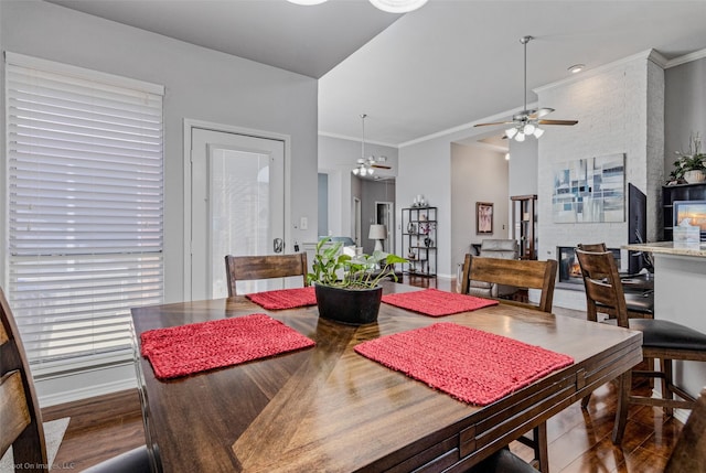 8502 Linda Vista Dr, Rowlett, TX 75088 - dining area featuring crown molding, ceiling fan, and wood finished floors