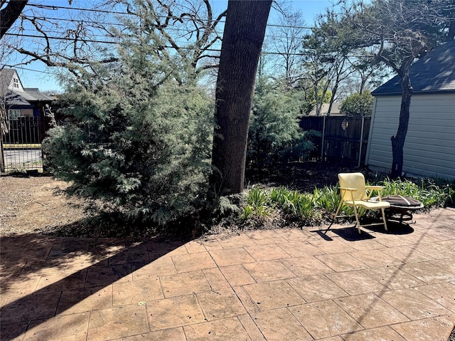 view of patio / terrace featuring fence