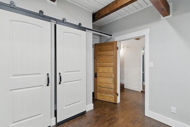 unfurnished bedroom featuring a barn door, wood ceiling, baseboards, beam ceiling, and dark wood-style floors