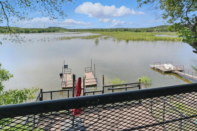 water view featuring a floating dock
