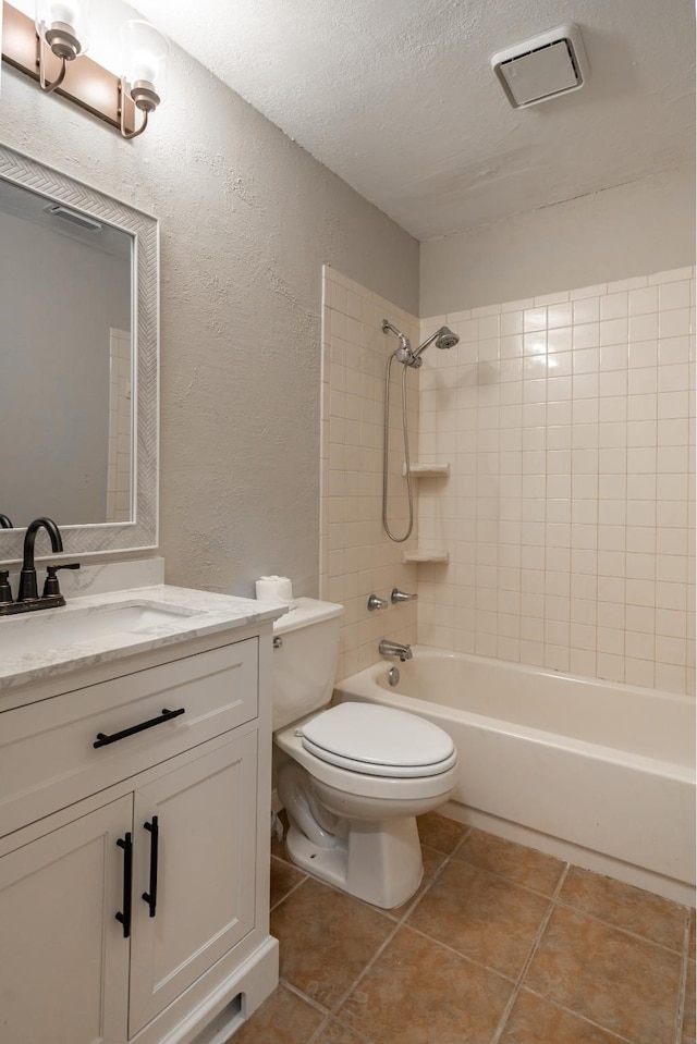 full bathroom with bathtub / shower combination, a textured wall, toilet, a textured ceiling, and vanity