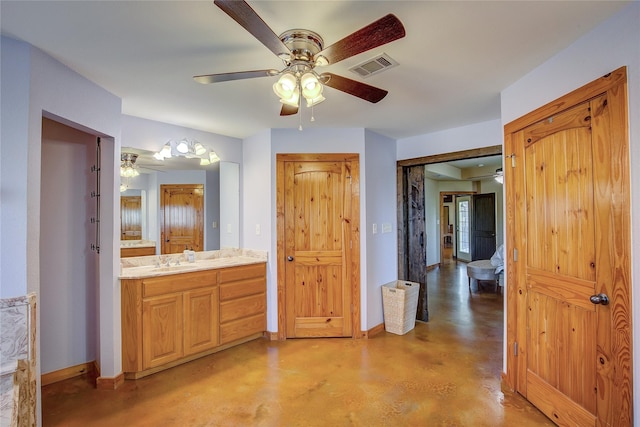 bathroom with ceiling fan, vanity, visible vents, finished concrete flooring, and baseboards