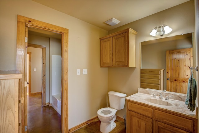 bathroom featuring visible vents, toilet, vanity, baseboards, and a bath