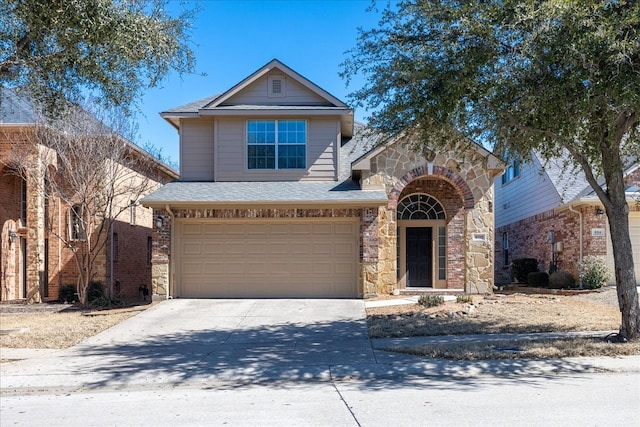 traditional home featuring stone siding, roof with shingles, driveway, and an attached garage