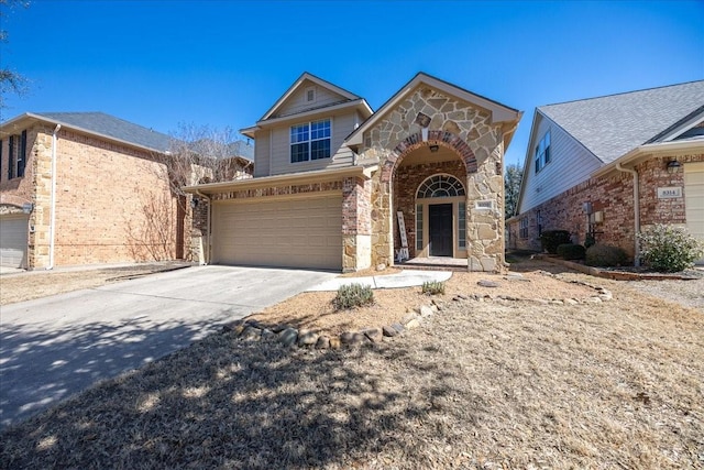 view of front of property with a garage, stone siding, and driveway