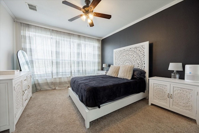 bedroom featuring light carpet, ceiling fan, visible vents, and crown molding