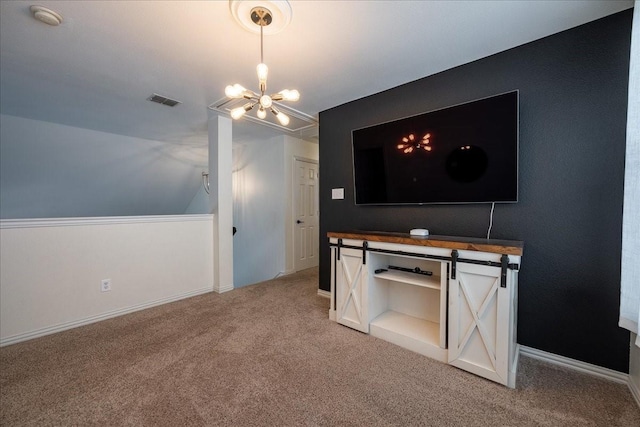 interior space with a chandelier, light colored carpet, visible vents, and baseboards