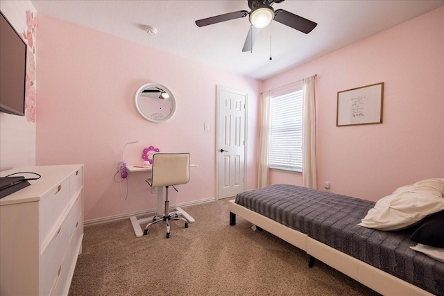 bedroom with light carpet, ceiling fan, and baseboards