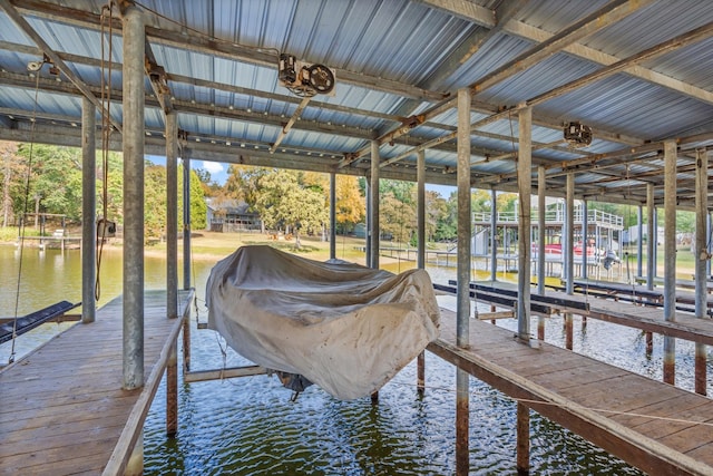 view of dock featuring a water view and boat lift