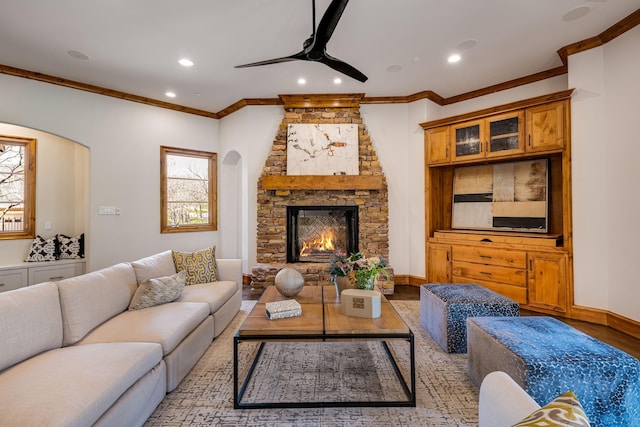 1717 Buckingham Dr, Keller, TX 76262 - living area featuring ornamental molding, a ceiling fan, recessed lighting, wood finished floors, and a stone fireplace