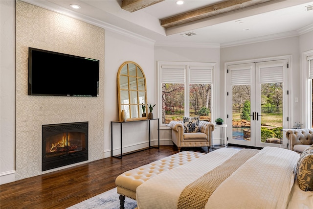 1717 Buckingham Dr, Keller, TX 76262 - bedroom with access to outside, wood finished floors, beam ceiling, a tiled fireplace, and french doors