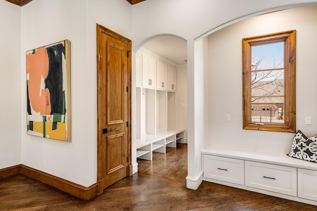 1717 Buckingham Dr, Keller, TX 76262 - mudroom featuring dark wood-style flooring, baseboards, and arched walkways