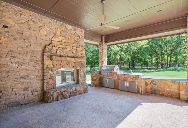 1717 Buckingham Dr, Keller, TX 76262 - view of patio / terrace featuring exterior kitchen, grilling area, ceiling fan, an outdoor stone fireplace, and a sink