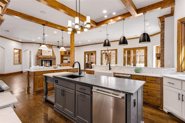 1717 Buckingham Dr, Keller, TX 76262 - kitchen with a sink, a spacious island, open floor plan, backsplash, and beamed ceiling