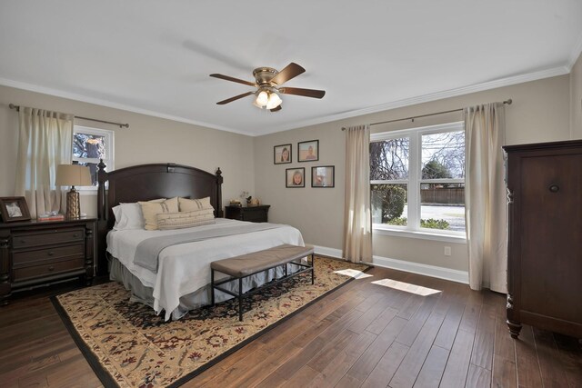 bedroom featuring ornamental molding, dark wood-type flooring, visible vents, and baseboards