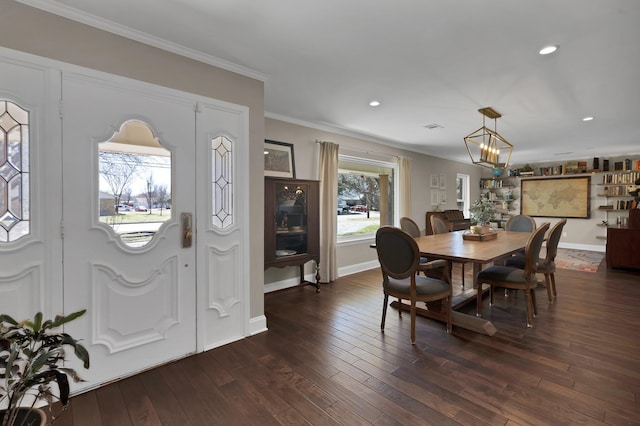 dining area featuring recessed lighting, a notable chandelier, dark wood-type flooring, baseboards, and crown molding