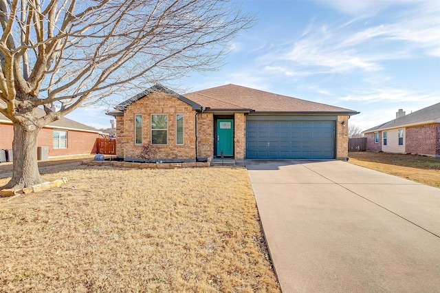 single story home with brick siding, roof with shingles, concrete driveway, a front yard, and a garage