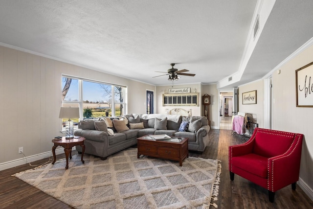 living area featuring a textured ceiling, ornamental molding, and wood finished floors