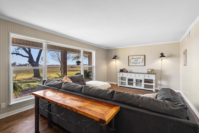 living area with crown molding, dark wood finished floors, and baseboards