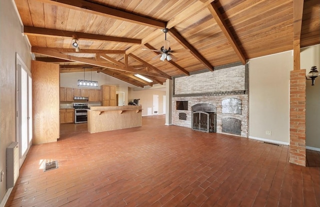 unfurnished living room featuring visible vents, a stone fireplace, a ceiling fan, and vaulted ceiling with beams