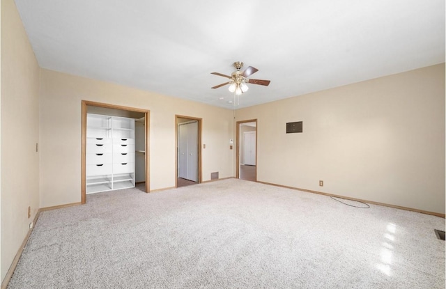 unfurnished bedroom with ceiling fan and baseboards