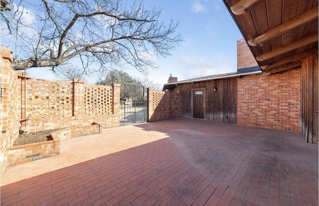 view of patio / terrace with a gate and fence