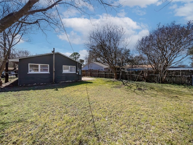 view of yard with a fenced backyard