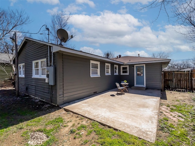 back of house featuring crawl space, a patio area, and fence