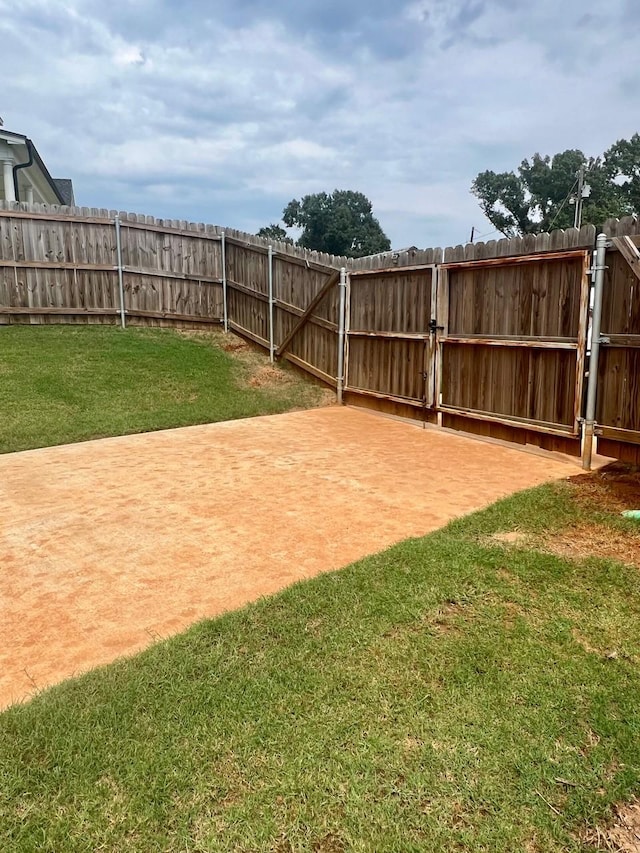 view of yard featuring a gate and fence