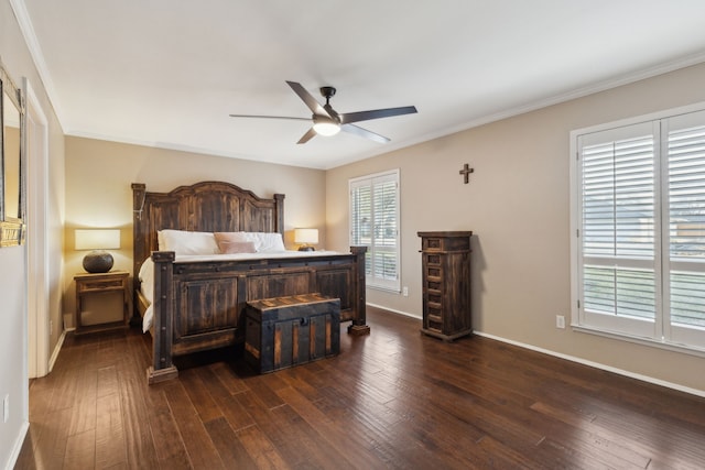 bedroom with dark wood-style floors, ceiling fan, baseboards, and crown molding